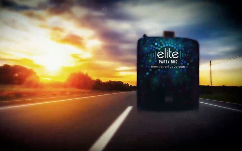 Bemidji Party Bus driving down a road.